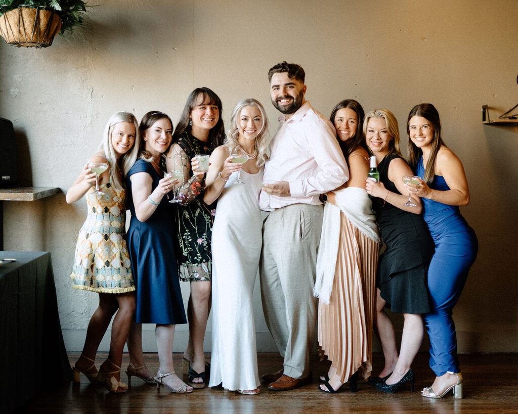 bride and her wedding party posed together